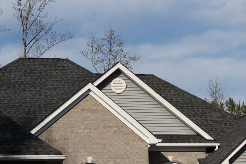 nice shingled roof on gray house