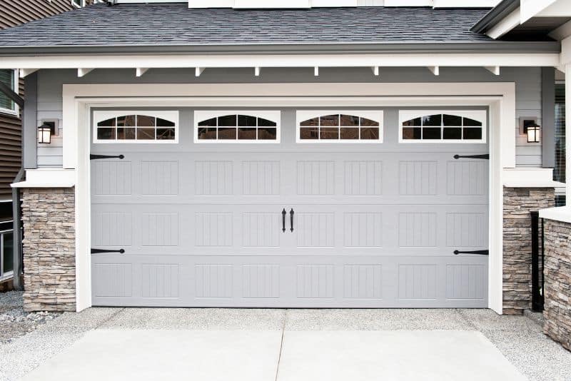 gray garage door with black handles