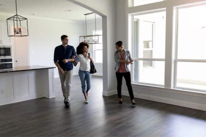 realtor showing house to couple