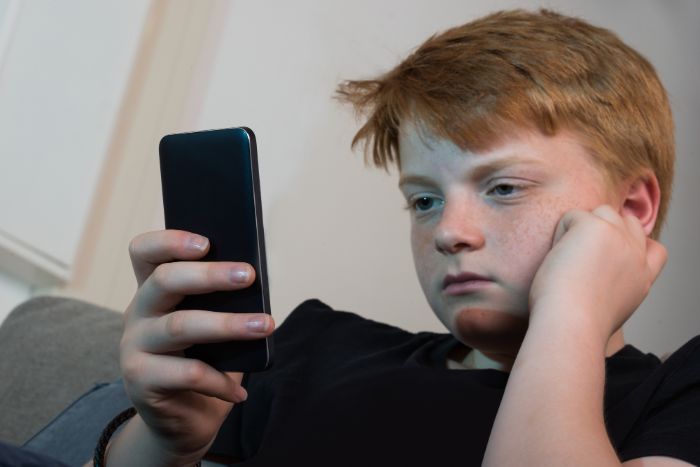 boy using smartphone