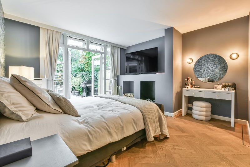 stylish bedroom gray walls luxurious bed and vanity