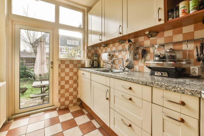 alternating tile pattern on kitchen floor and walls