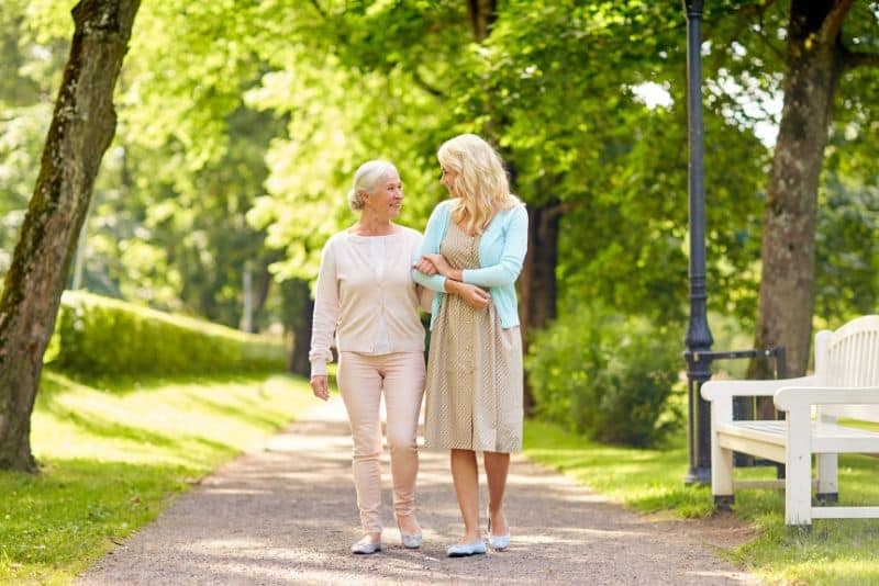 woman walking with her elderly mother