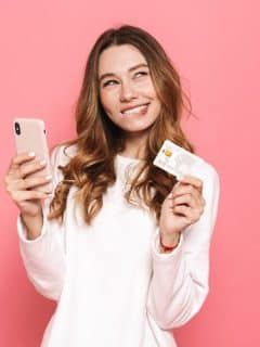 woman with card and smartphone