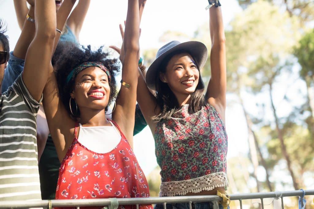 women having fun at music festival