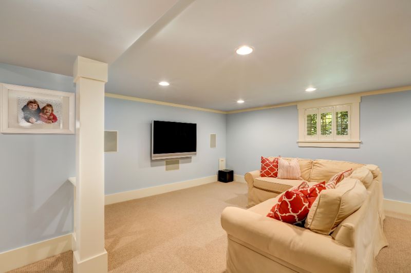 light blue basement living area