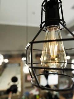 cage light fixture hanging from ceiling