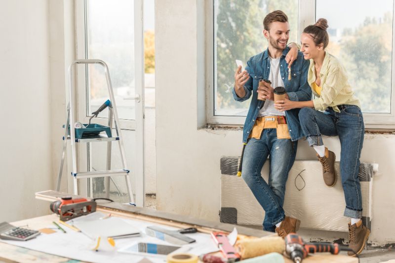 couple enjoying a coffee break during a home reno