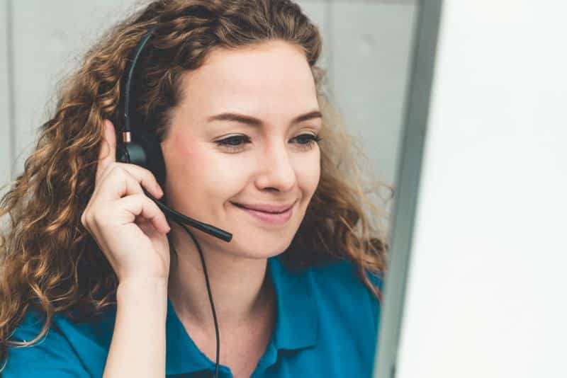 smiling customer service rep with headset