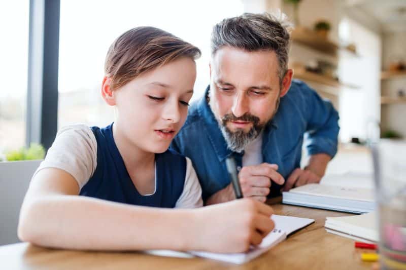 dad helping child with homework