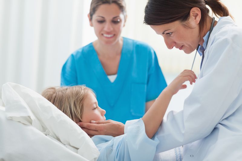 doctor examining a child in the hospital