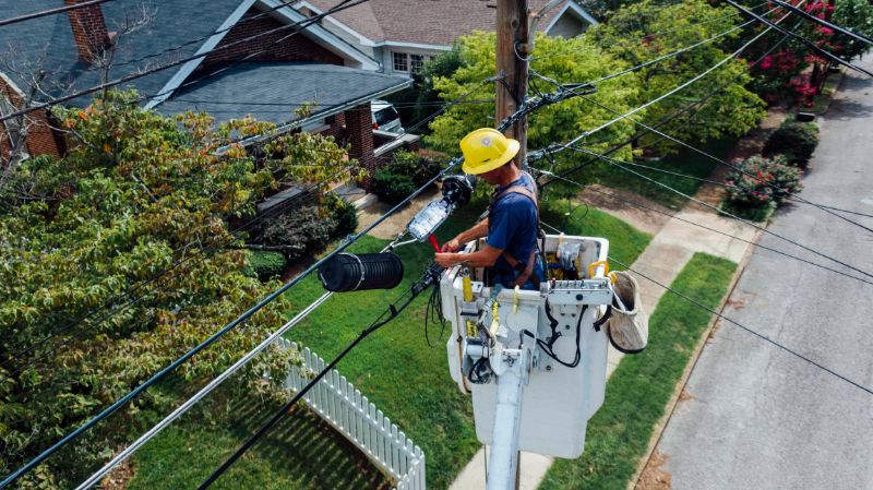 electrician in motor control bucket repairing wires