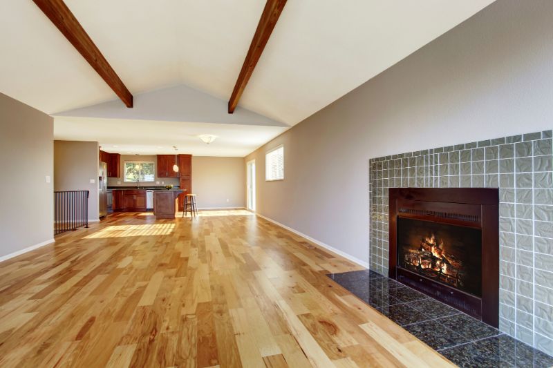 empty room with fireplace and hardwood floors