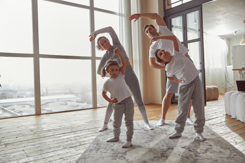 family of 4 exercising together