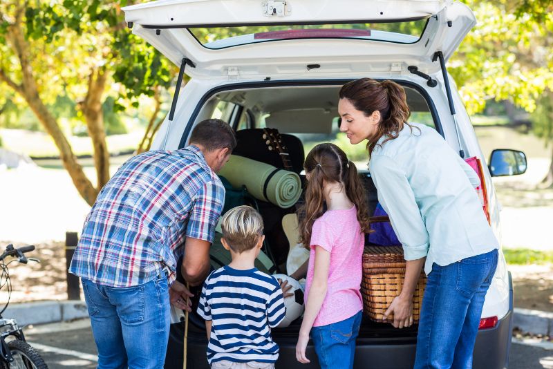 family packing car for road trip