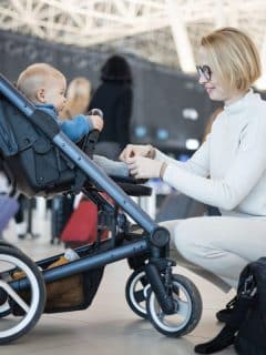mother and infant boy at airport