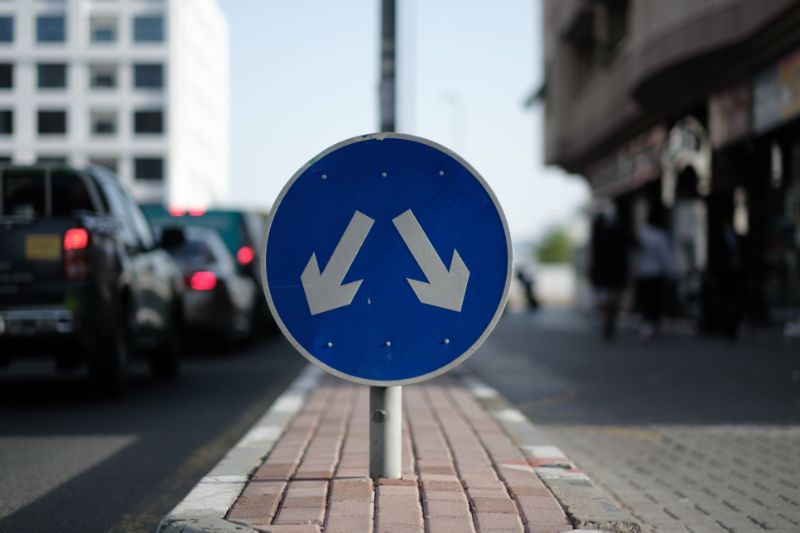 a blue sign pointing in two different directions