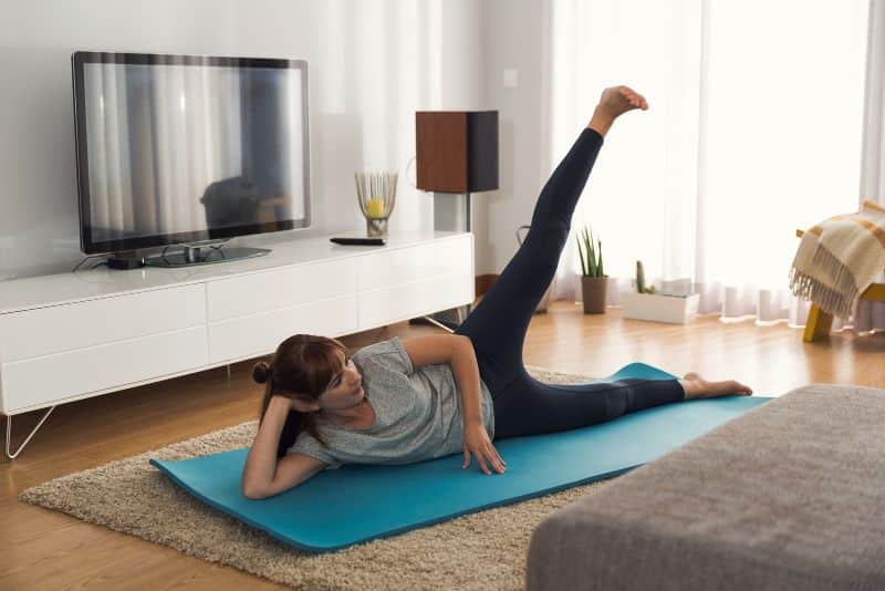 woman exercising in living room