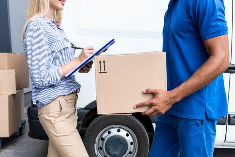 woman signing for a package