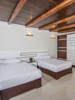 wooden ceiling with wooden beams in bedroom