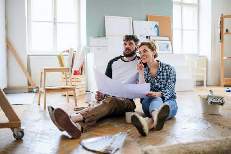 couple looking at renovation plans