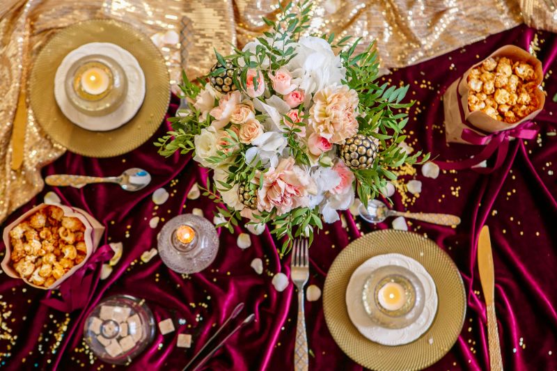 gourmet popcorn on table with wedding bouquet
