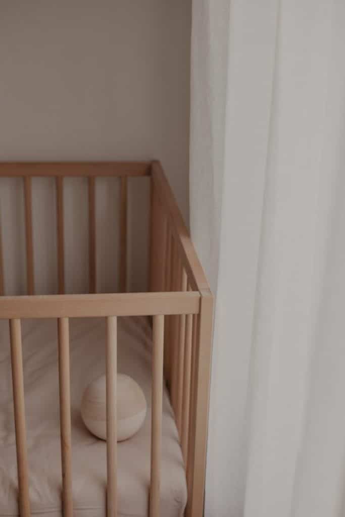 wooden crib soft neutral tons