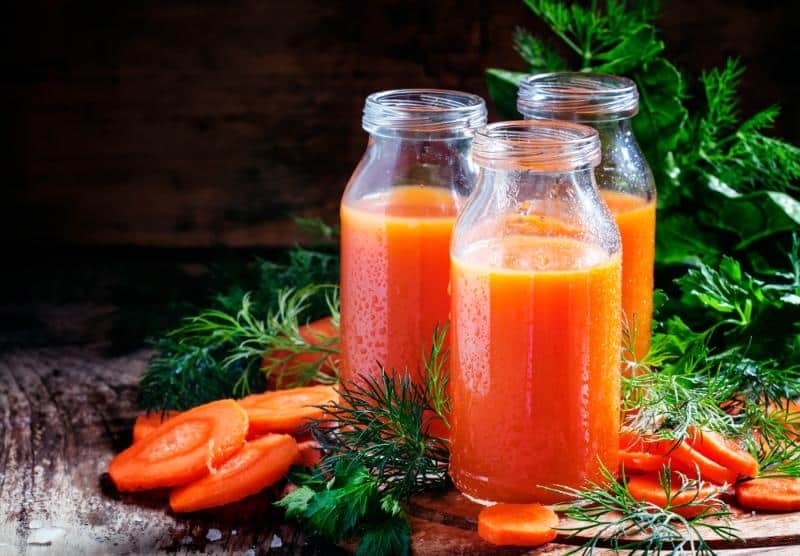 carrot juice in glass bottles