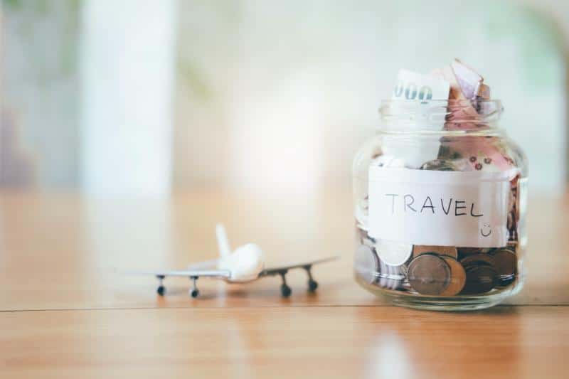 travel savings jar and miniature airplane