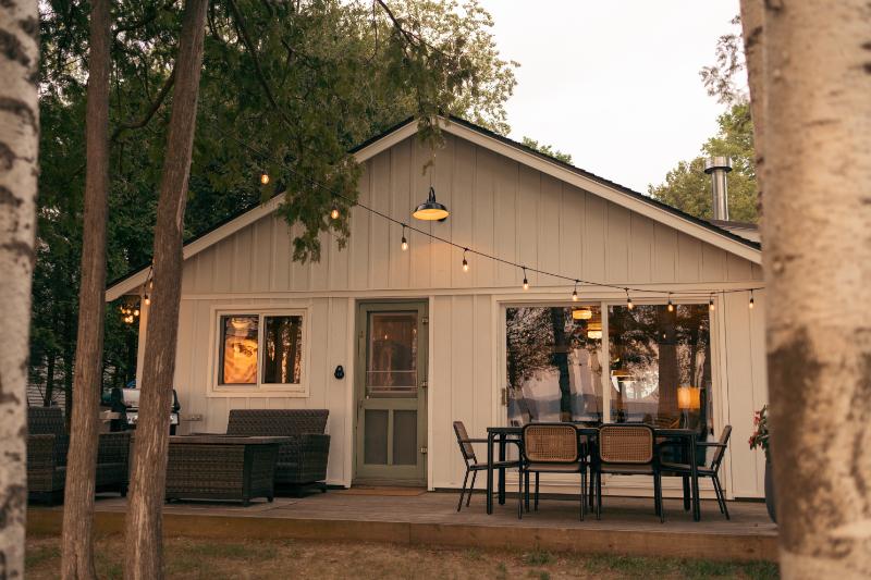 small house with cute outdoor space at dusk