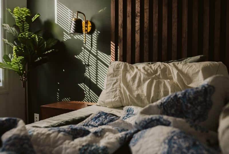 bedroom with slatted wooden headboard