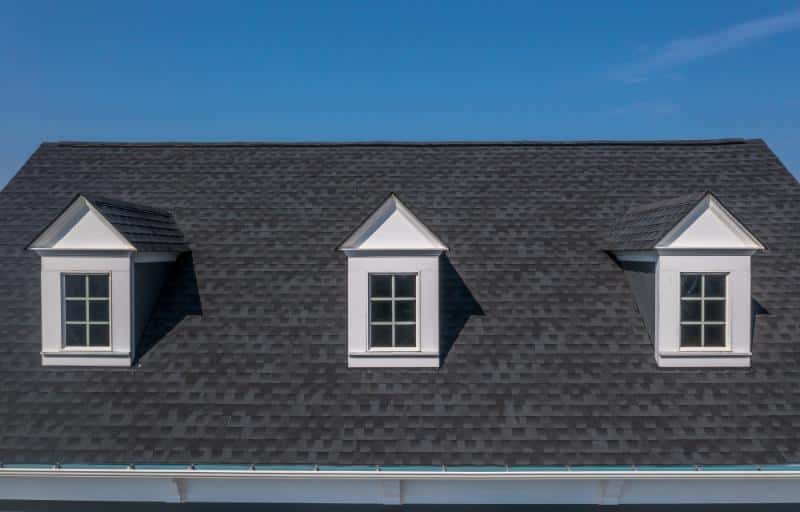 shingled roof with three dormers