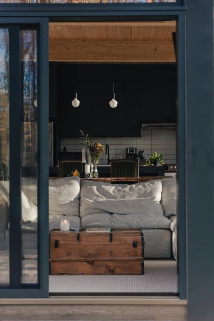 comfy couch in front of sliding glass door