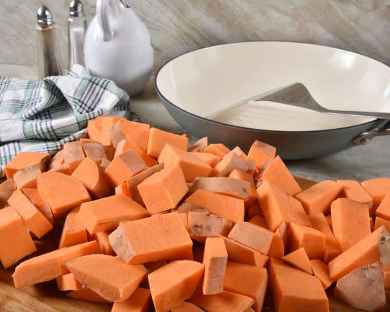 diced sweet potatoes and skillet in background