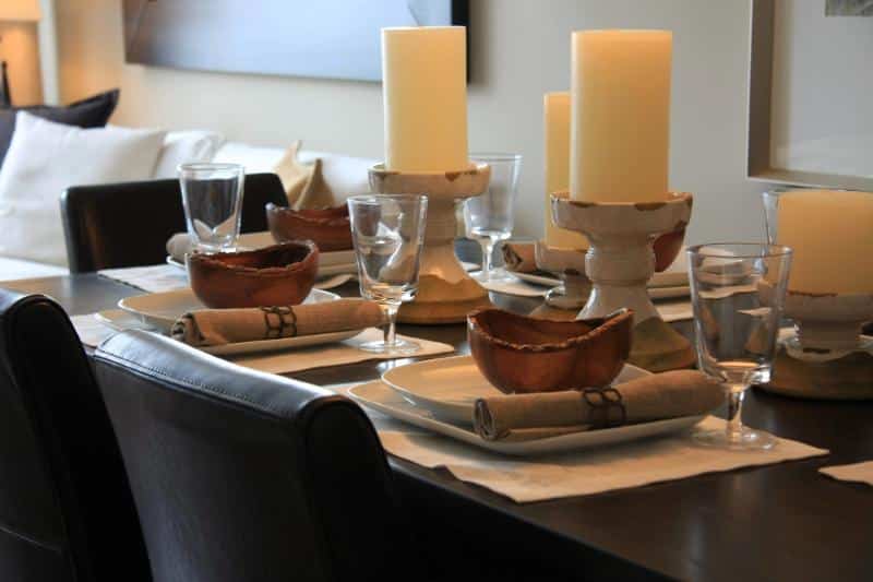 dining table with large candle centerpieces