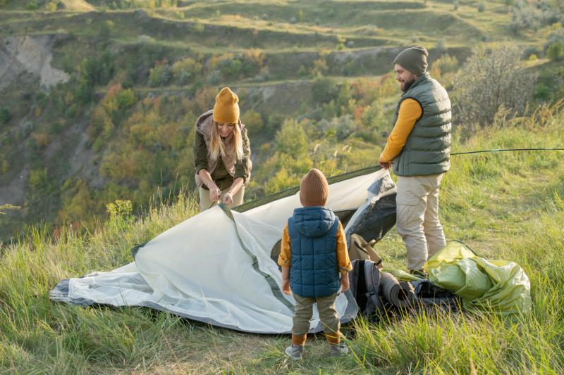 family setting up a tent