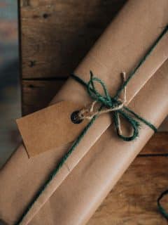 box wrapped in brown paper and tied with green string