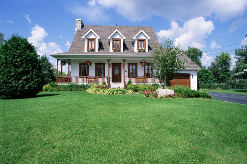 cute house with dormers and big porch