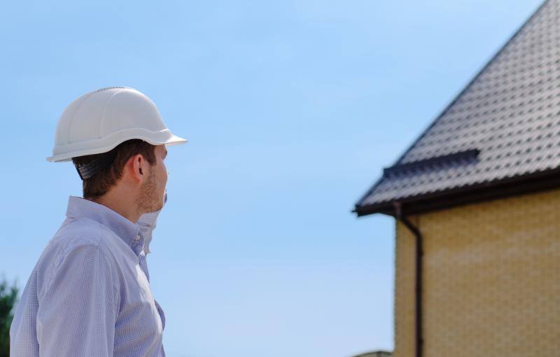 inspector looking toward roof