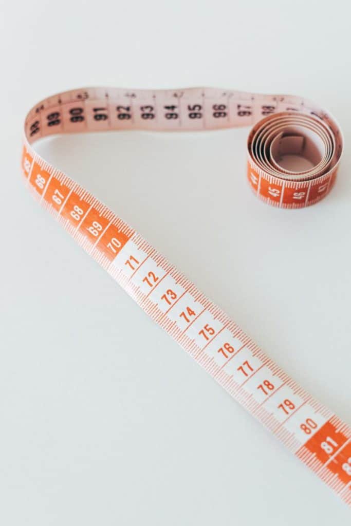 measuring tape to take your measurements during a weight loss journey