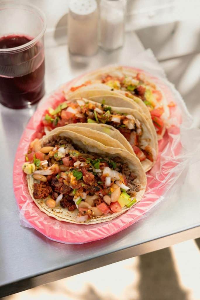 street tacos on pink plate
