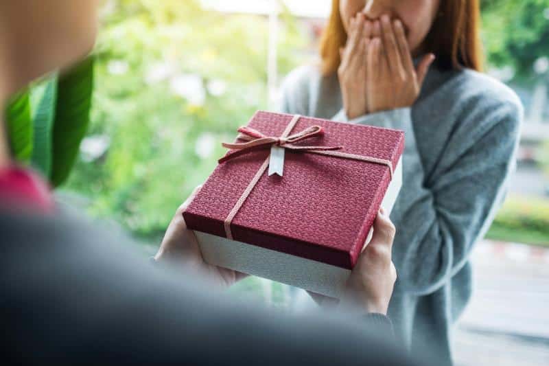 woman receiving a surprise gift