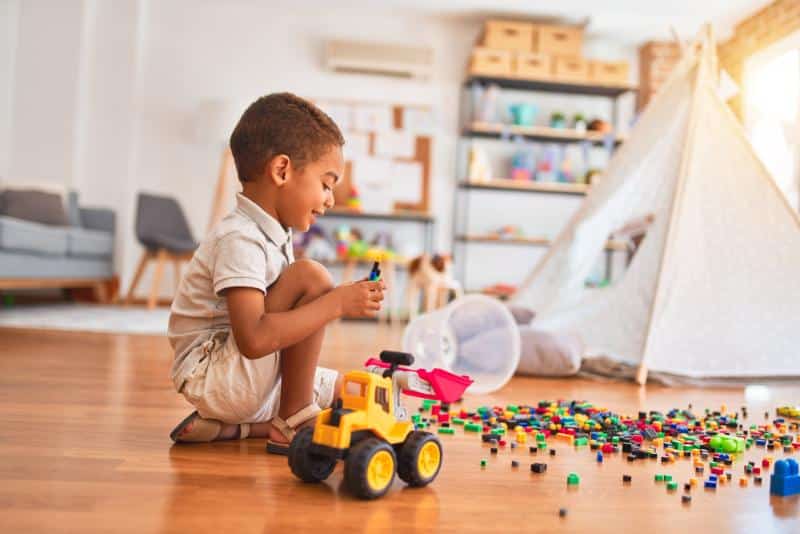 toddler playing with toys