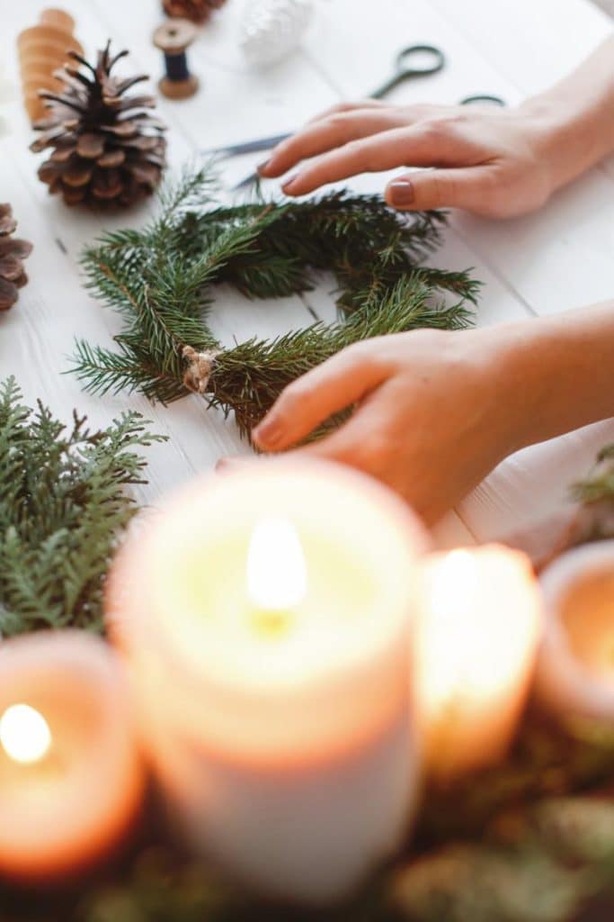 winter decorating with evergreens and candles