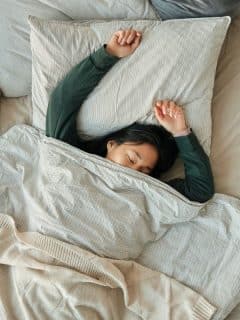 woman relaxing in bed