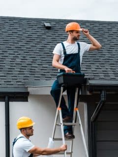 two men working on roof