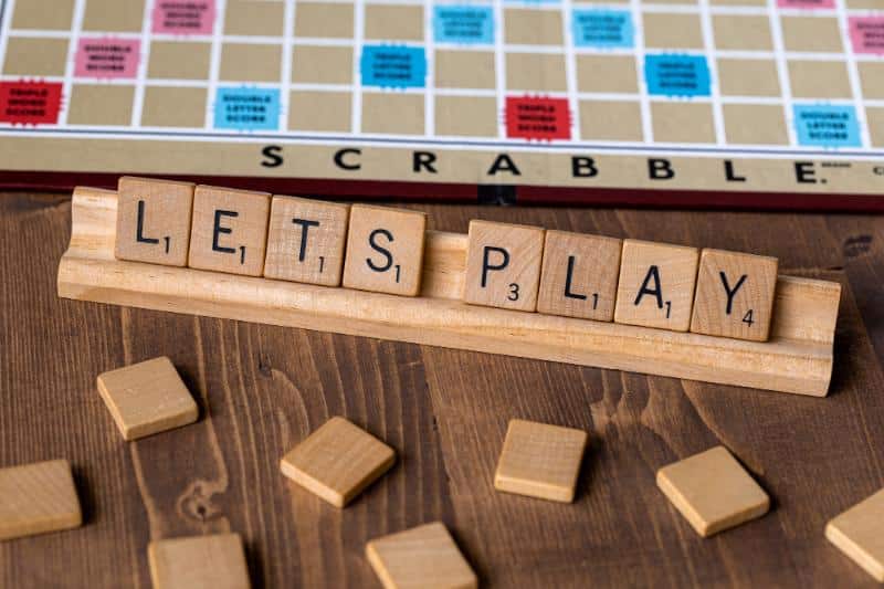 scrabble board and tiles