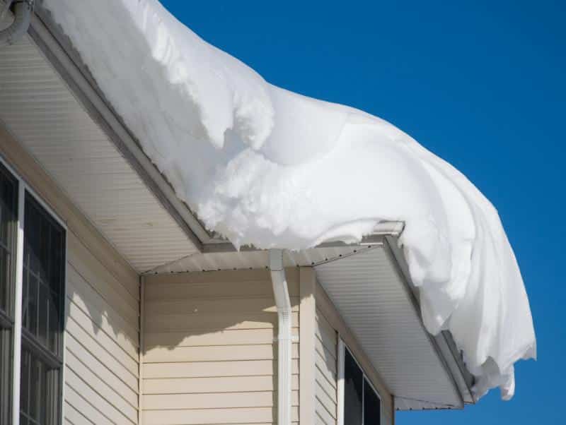 heavy snow on a roof ready to fall off