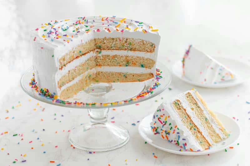sliced rainbow sprinkle cake
