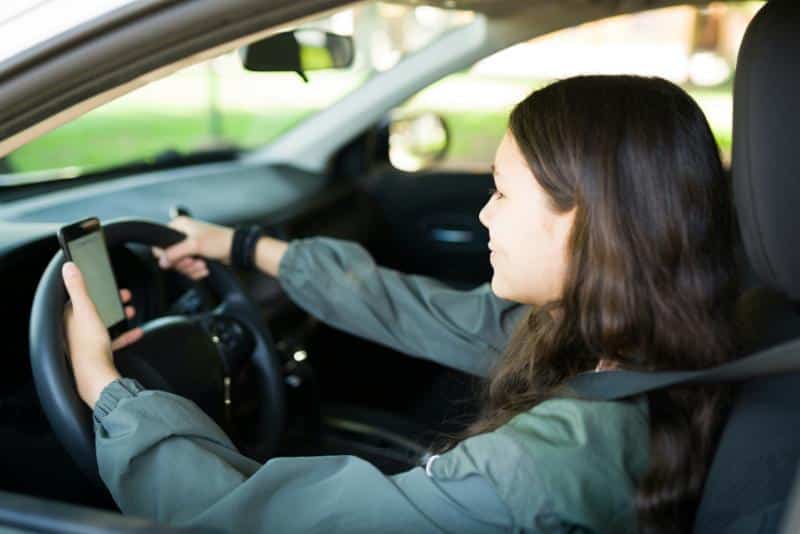 teen girl looking at gps on phone